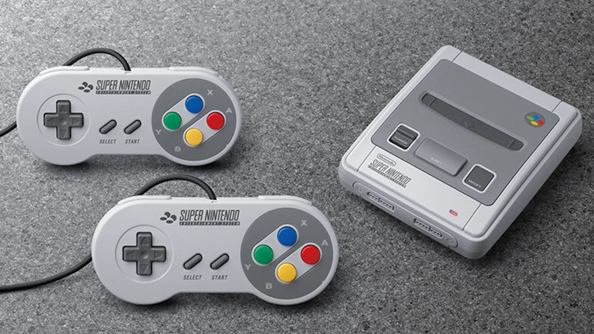 Bộ console SNES Classic và hai tay cầm đặt trên thảm.
