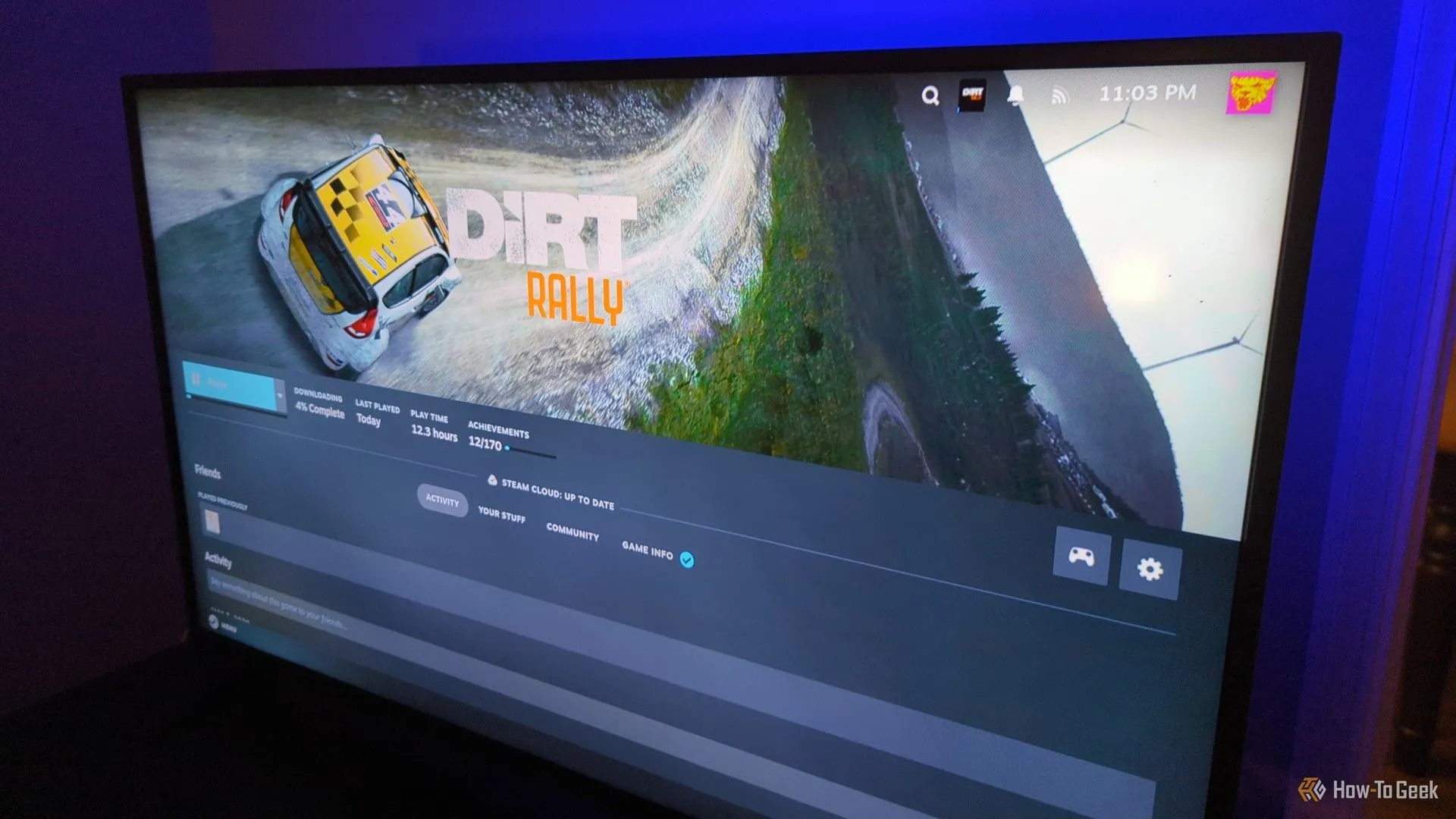 Màn hình TV đang cài đặt game Dirt Rally trên Steam