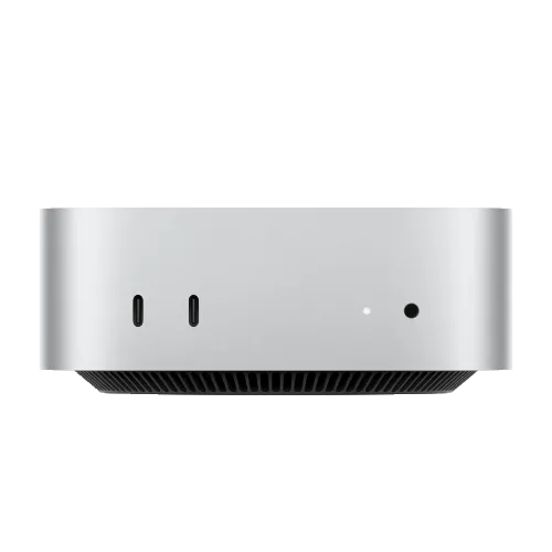 Máy tính để bàn Apple Mac Mini M4 nhỏ gọn, màu bạc, đặt trên bàn gỗ