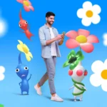 Người đàn ông đi bộ trên đường phố, chơi game Pokémon GO hoặc Pikmin Bloom trên điện thoại thông minh, minh họa tính di động vượt trội của game Android.