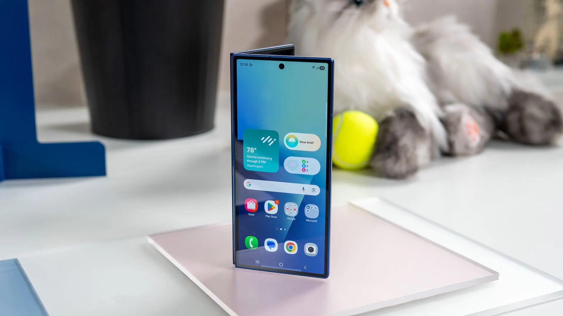 samsung galaxy z fold 7 standing on display showing the home screen on the cover display