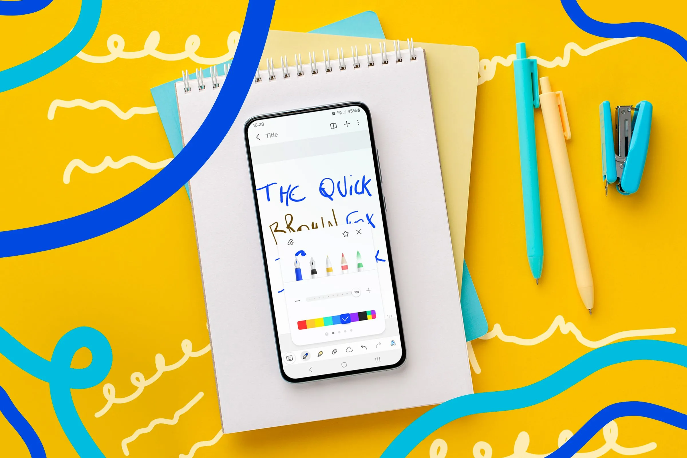 Sổ tay vật lý đặt cạnh điện thoại hiển thị ứng dụng ghi chú Samsung Notes, thể hiện sự chuyển đổi từ ghi chép truyền thống sang kỹ thuật số