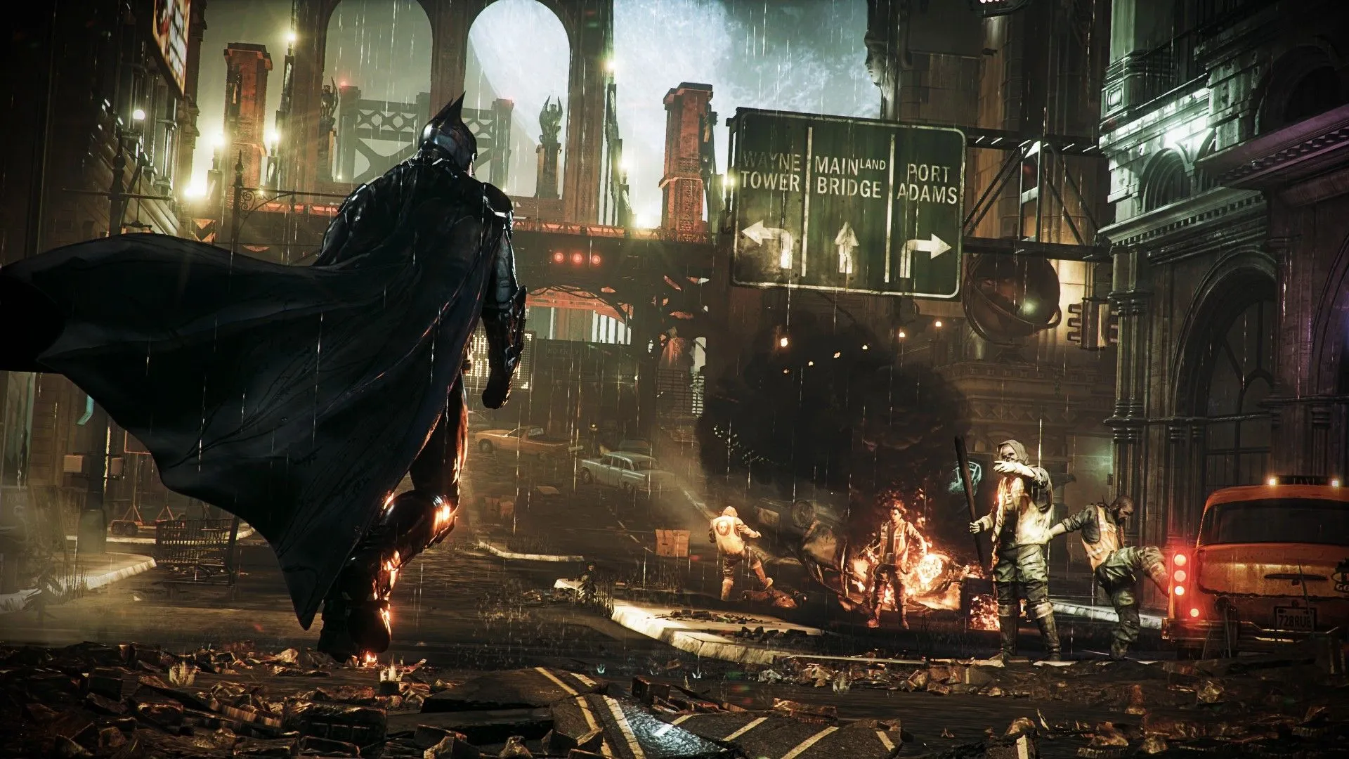 Batman đối mặt với tội phạm phá hoại thiết bị trong Batman Arkham Knight, thể hiện vai trò thám tử.