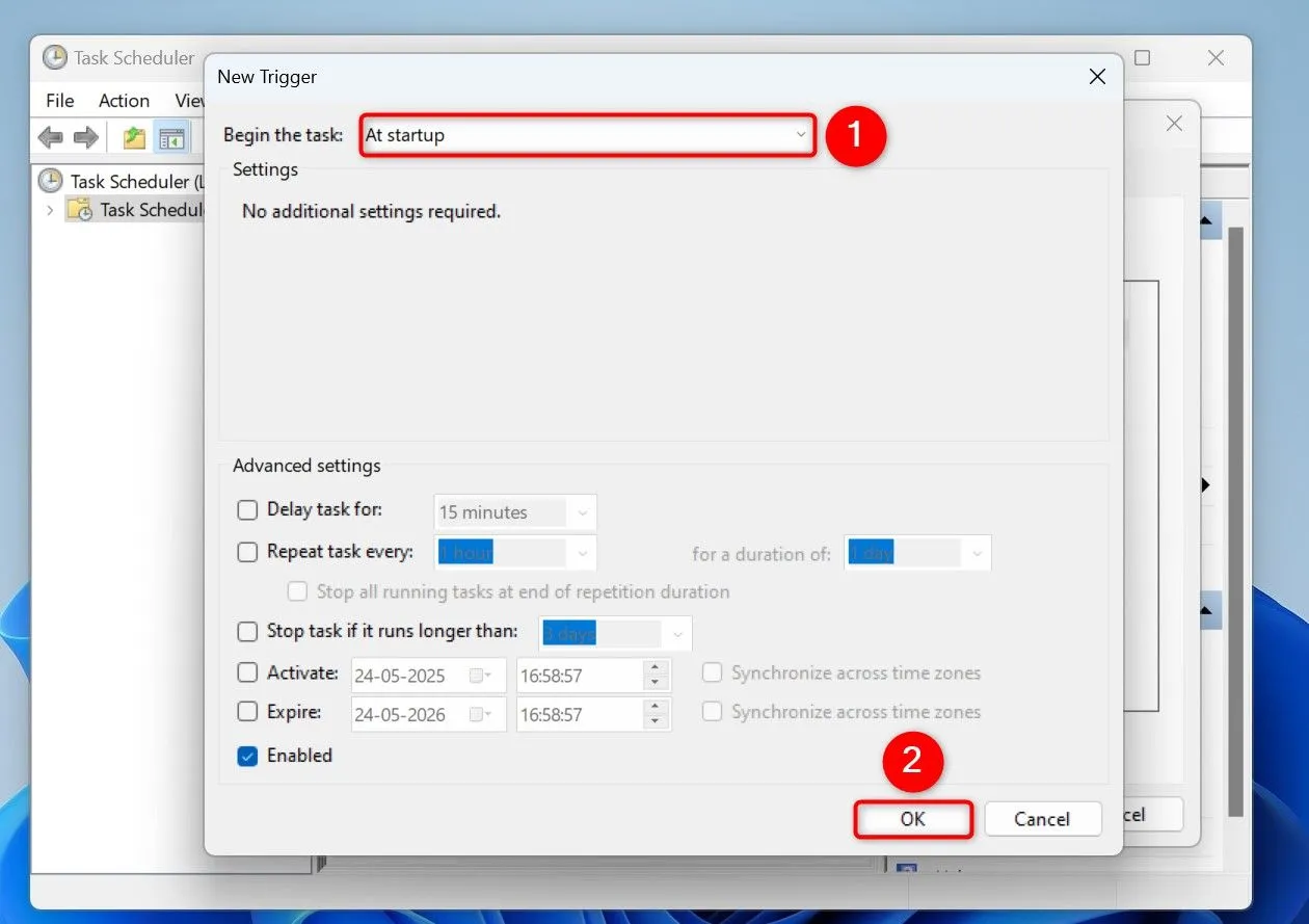 Cửa sổ cấu hình trình kích hoạt tác vụ trong Task Scheduler, với tùy chọn &quot;At Startup&quot; được chọn để script chạy tự động khi Windows 11 khởi động