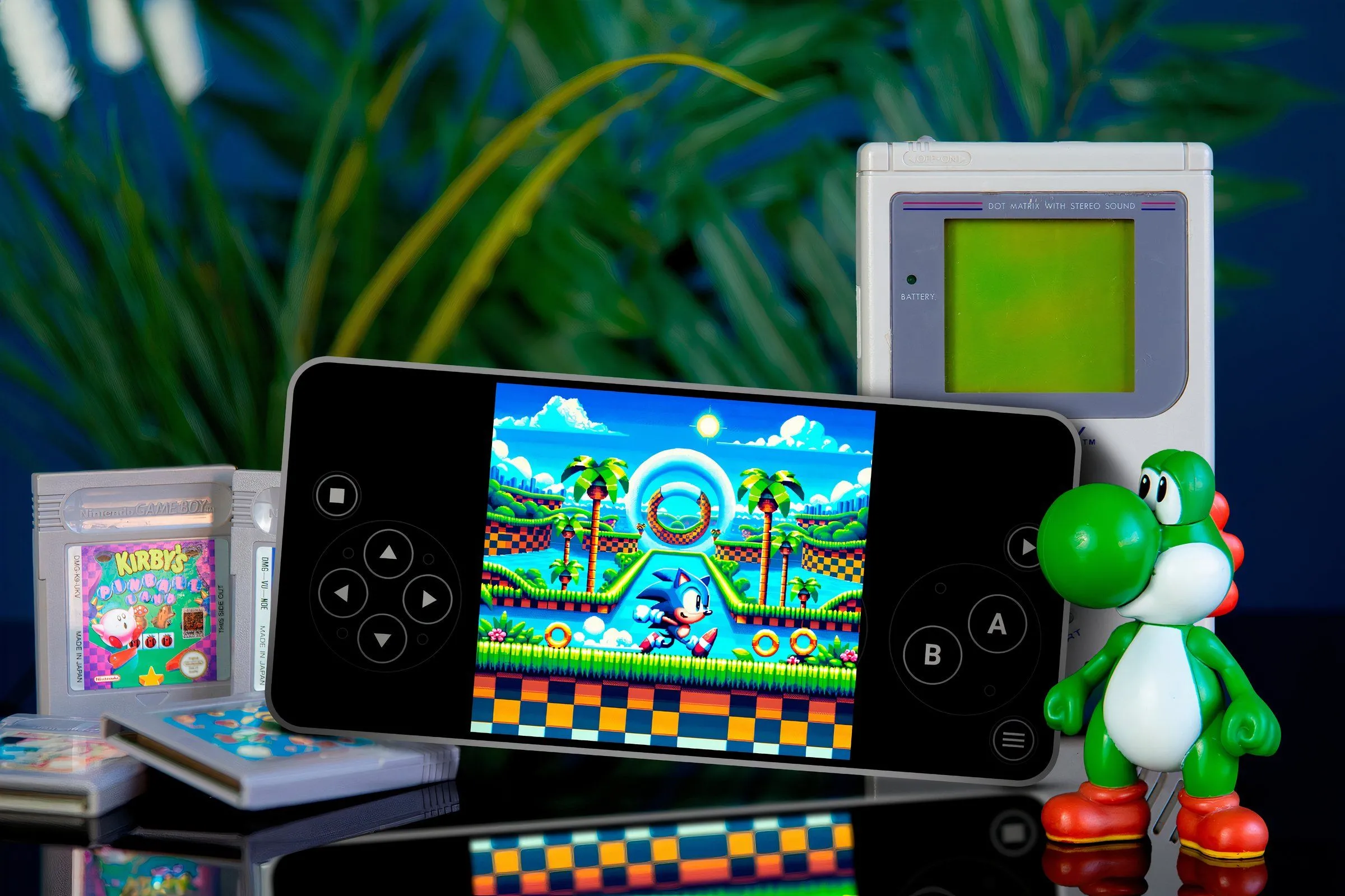 Điện thoại chạy game Sonic qua giả lập, xung quanh là băng game, mô hình Yoshi và máy Game Boy, minh họa việc chơi ROM game retro trên smartphone.