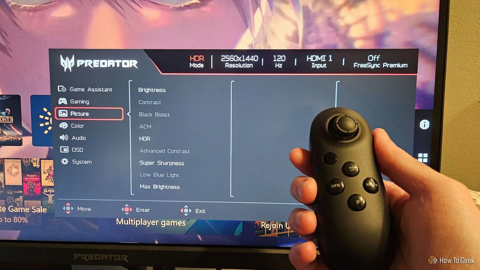 Điều khiển từ xa và menu OSD của màn hình Acer Predator XB273K V5, cho phép người dùng dễ dàng thay đổi cài đặt.