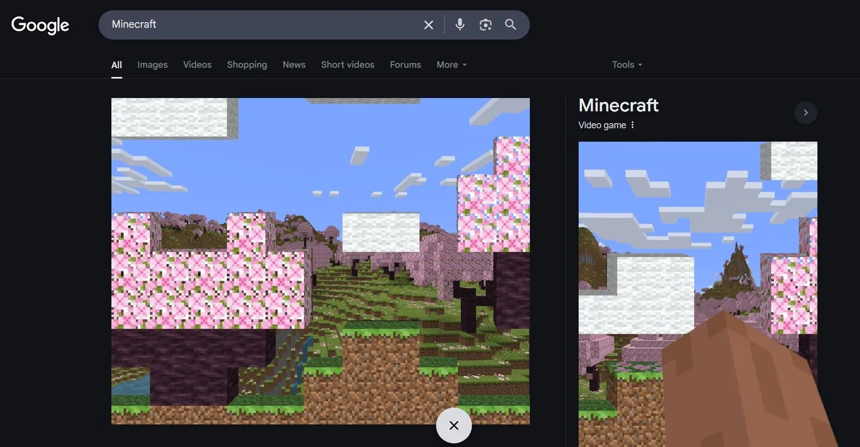 Easter egg Minecraft với khối đất và cánh tay Steve khi tìm kiếm Minecraft trên Google.