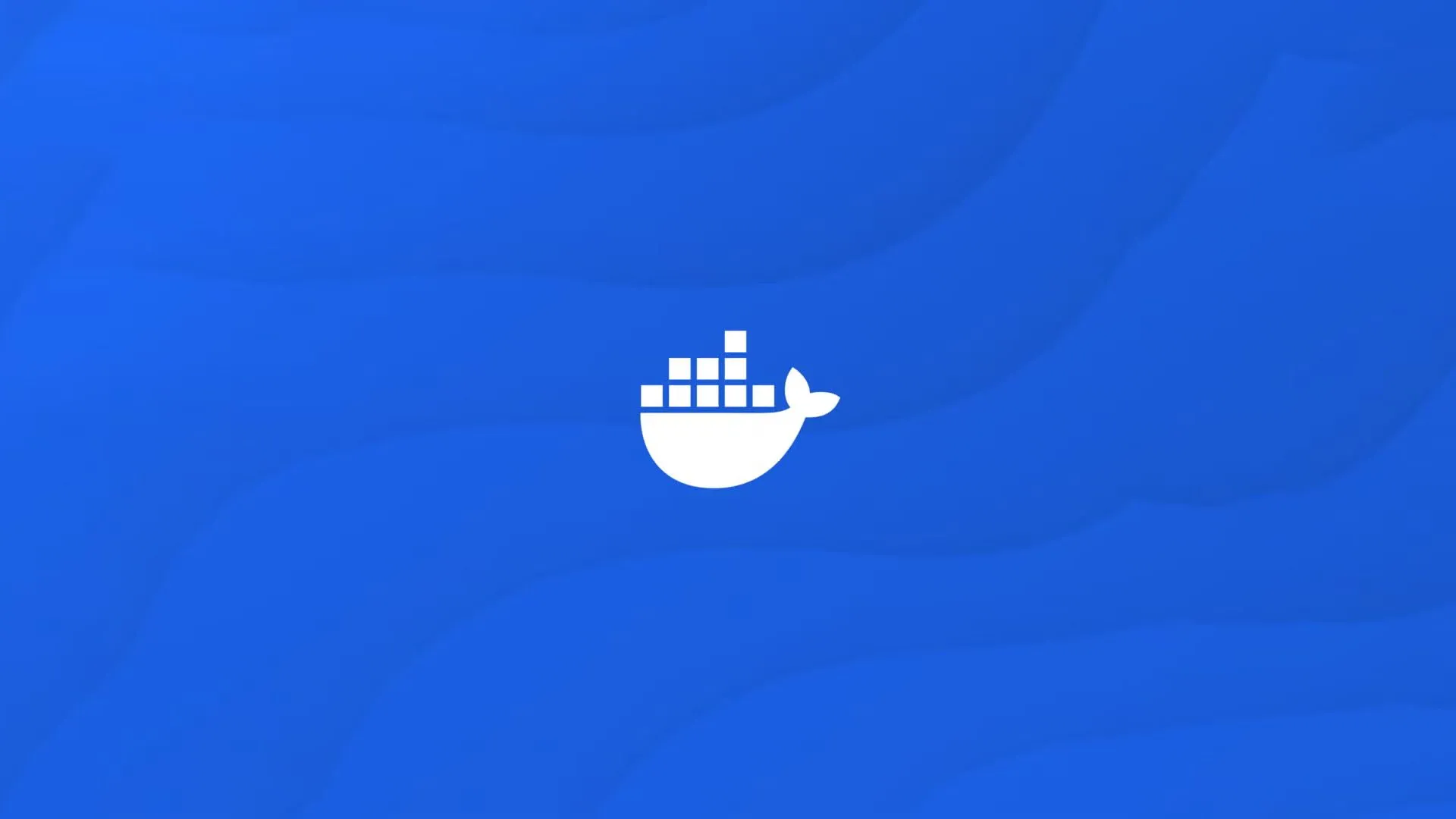 Logo Docker màu trắng nổi bật trên nền xanh dương với các đường nét biểu tượng, thể hiện sự nhẹ nhàng và linh hoạt của Docker container.