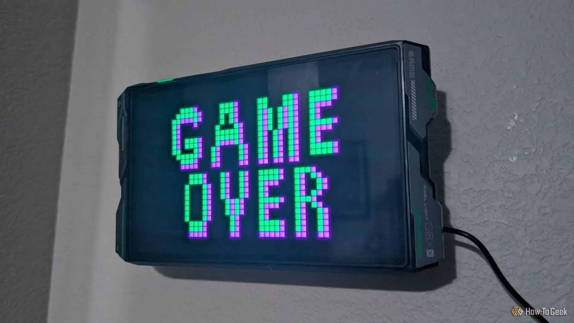 Màn hình đèn LED Govee Gaming Pixel Light hiển thị chữ 'Game Over', báo hiệu game gacha sắp dừng dịch vụ.