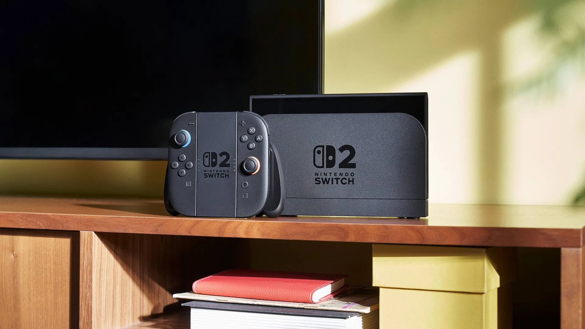 Máy chơi game Nintendo Switch 2 gắn Joy-Cons, đang kết nối với TV qua dock