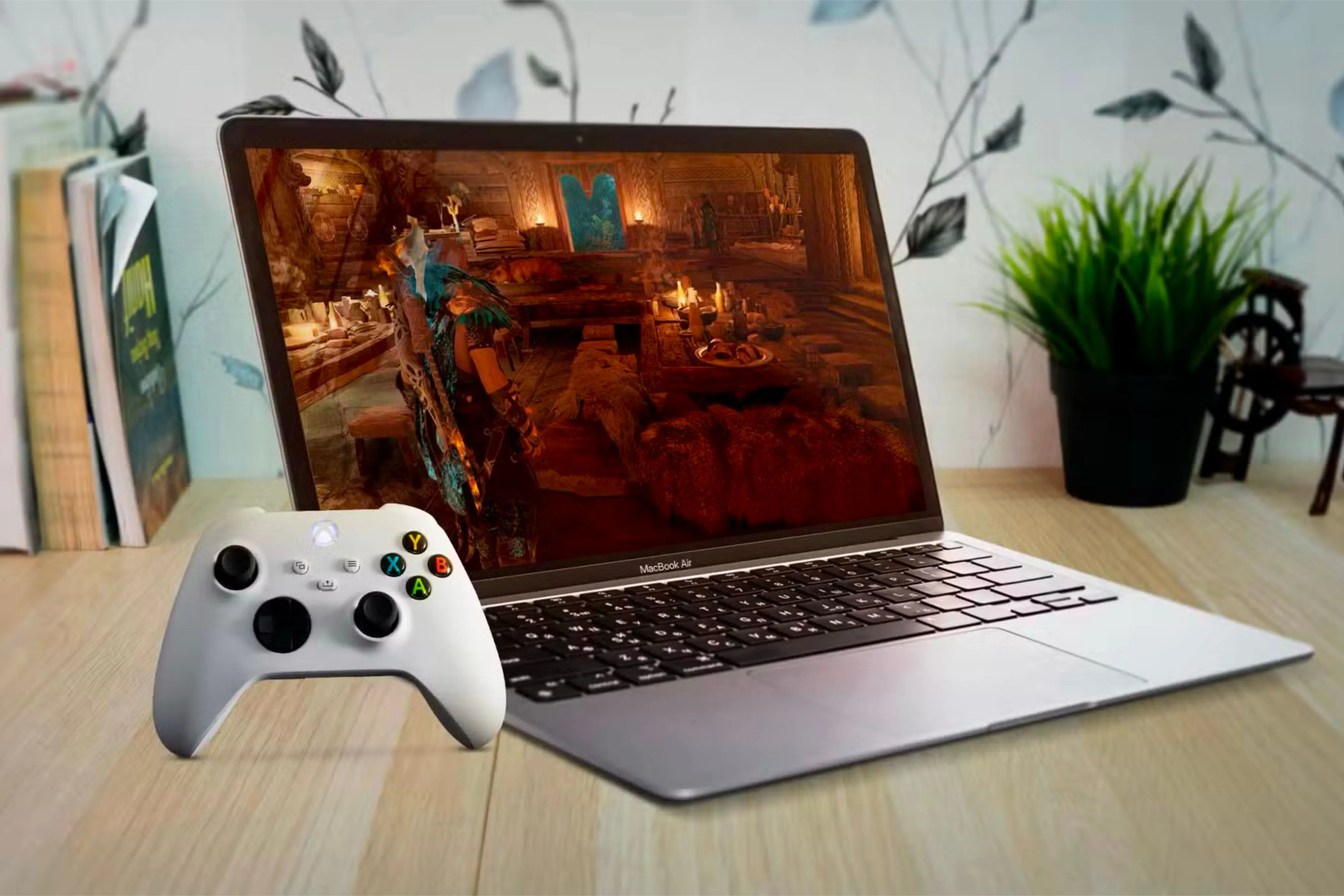 Một chiếc MacBook Air chơi game với tay cầm Xbox, minh họa xu hướng người dùng Mac tích hợp trải nghiệm gaming vào công việc hàng ngày