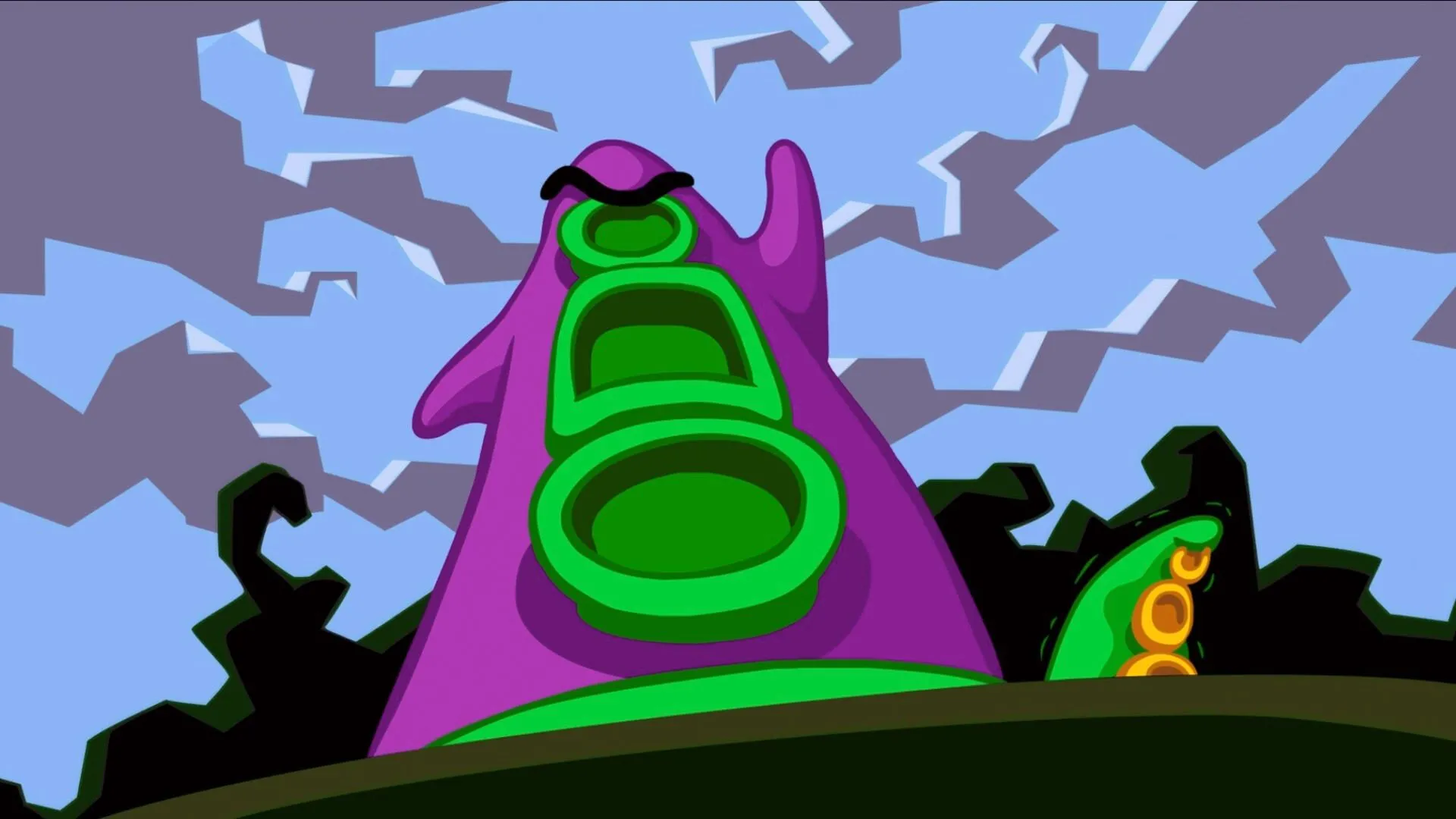 Một xúc tu lớn màu tím và một xúc tu xanh nhỏ hơn trong Day of the Tentacle, nơi có thể chơi Maniac Mansion đầy đủ.