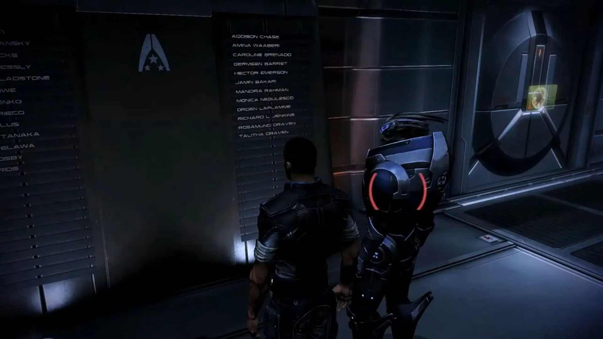 Shepard và Garrus trước bức tường tưởng niệm trong Mass Effect 3, gợi nhắc về những lựa chọn và hệ quả, đồng thời phản ánh tâm lý tìm kiếm lối chơi &quot;hoàn hảo&quot; trong game RPG.